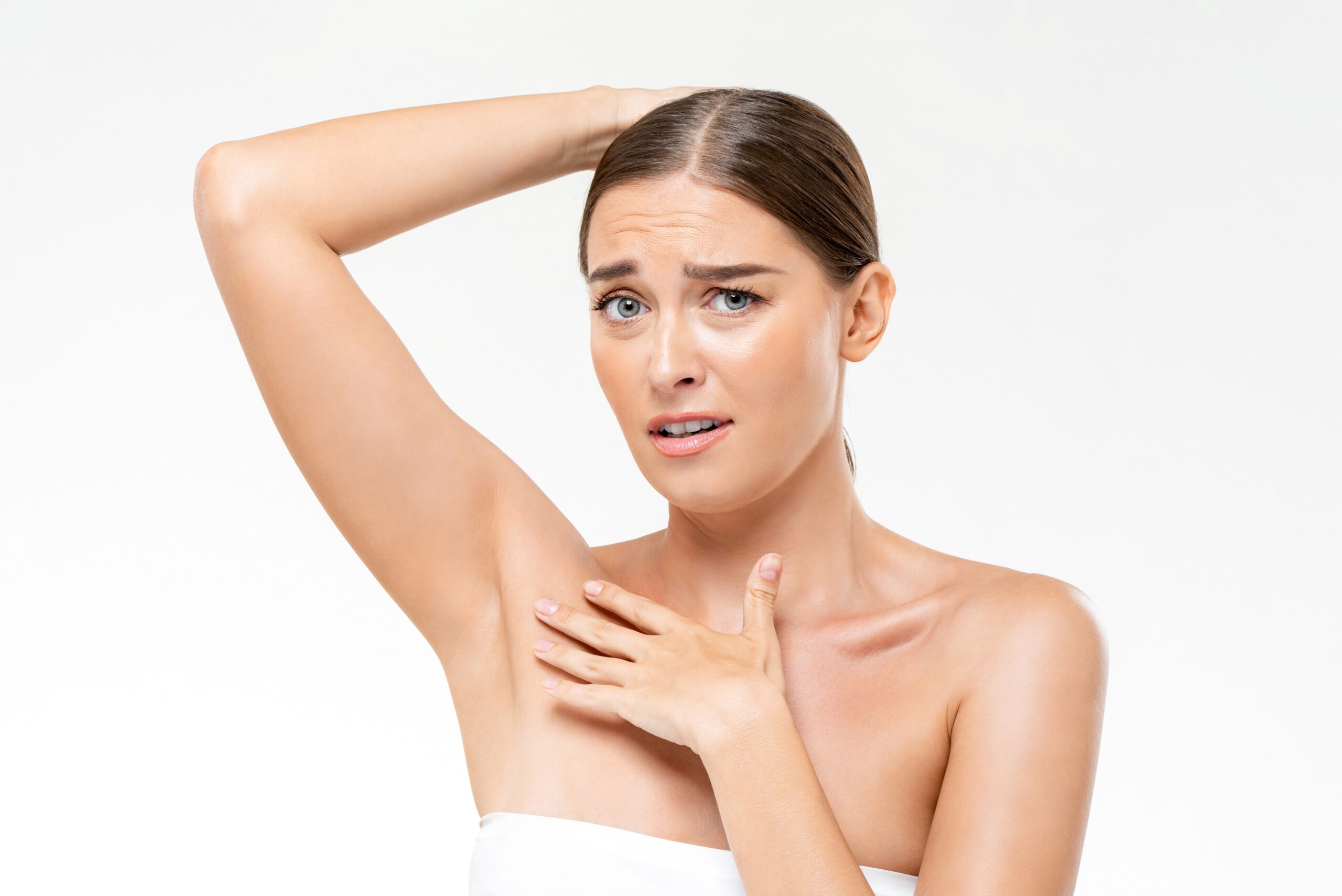 Embarrassed,Caucasian,Woman,In,Towel,With,Disconcerted,Face,Showing,Armpit