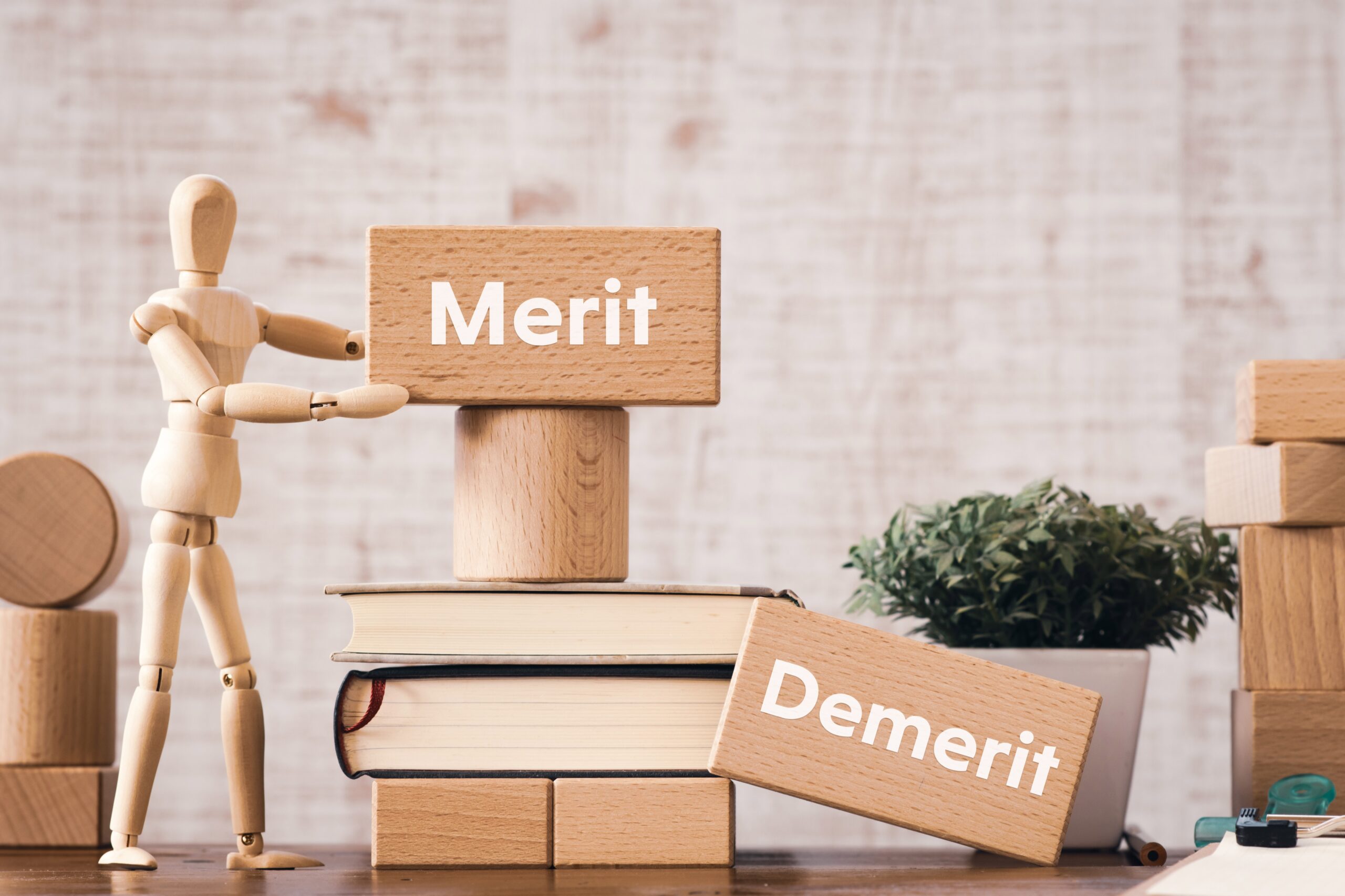 There,Is,Wood,Block,With,The,Word,Merit,Demerit.,It