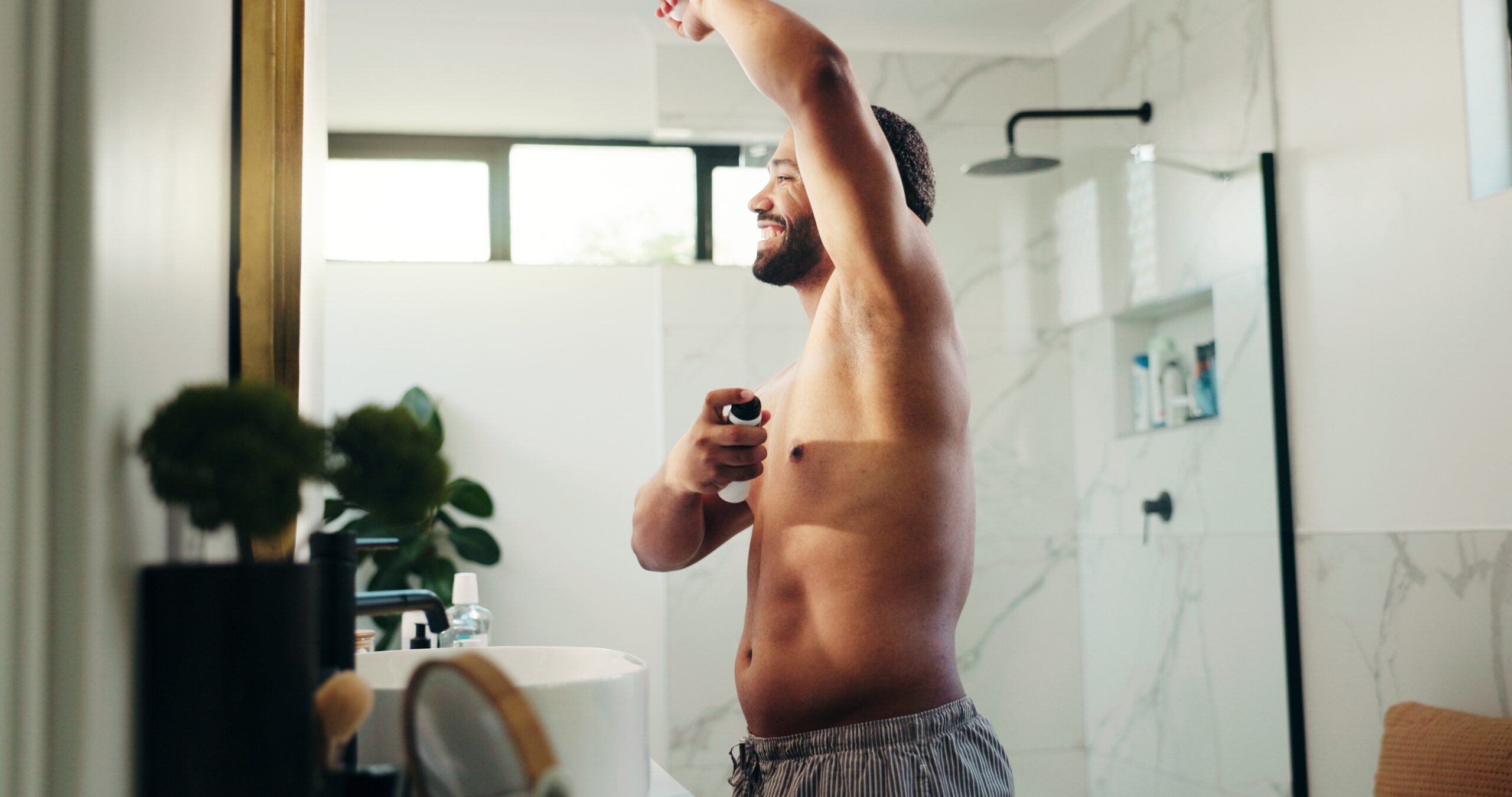 Hygiene,,Man,And,Spray,Deodorant,In,Bathroom,For,Sweat,Control,